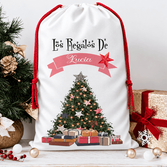 Saco de Navidad personalizado “Los regalos de…” con nombre en rosa y árbol navideño · De Moi à Toi