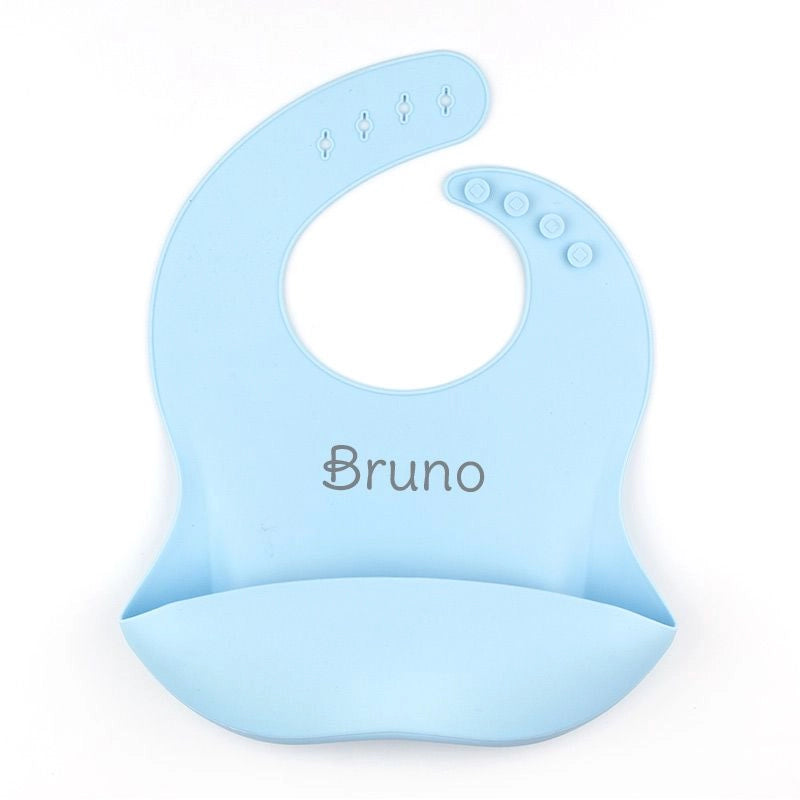 Babero flexible de silicona para bebé, personalizado con nombre y color favorito.