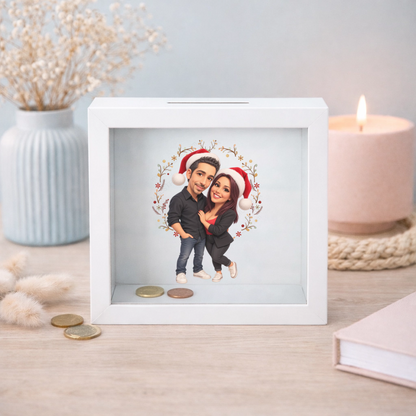 Hucha de cristal personalizada con caricatura navideña de pareja con gorros de Papá Noel, sin dedicatoria